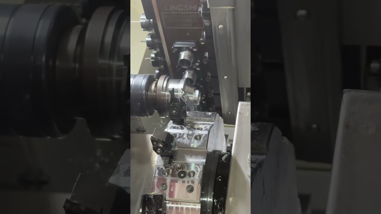 CNC lathe turning a stepped shaft